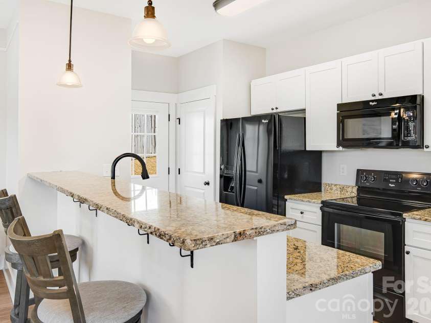 11 Byrdcliffe Lane, Asheville, NC 28805.  MLS# CAR4320731, YatesRealty ID 19996. Kitchen with 2 Pantries