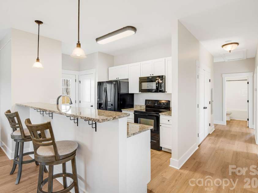 11 Byrdcliffe Lane, Asheville, NC 28805.  MLS# CAR4320731, YatesRealty ID 19996. Open Kitchen with Two Pantries