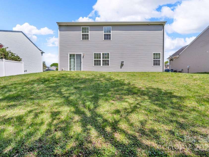 2115 Sage Meadows Drive, Winston Salem, NC 27127.  MLS# CAR4238449, YatesRealty ID 19996. Backyard