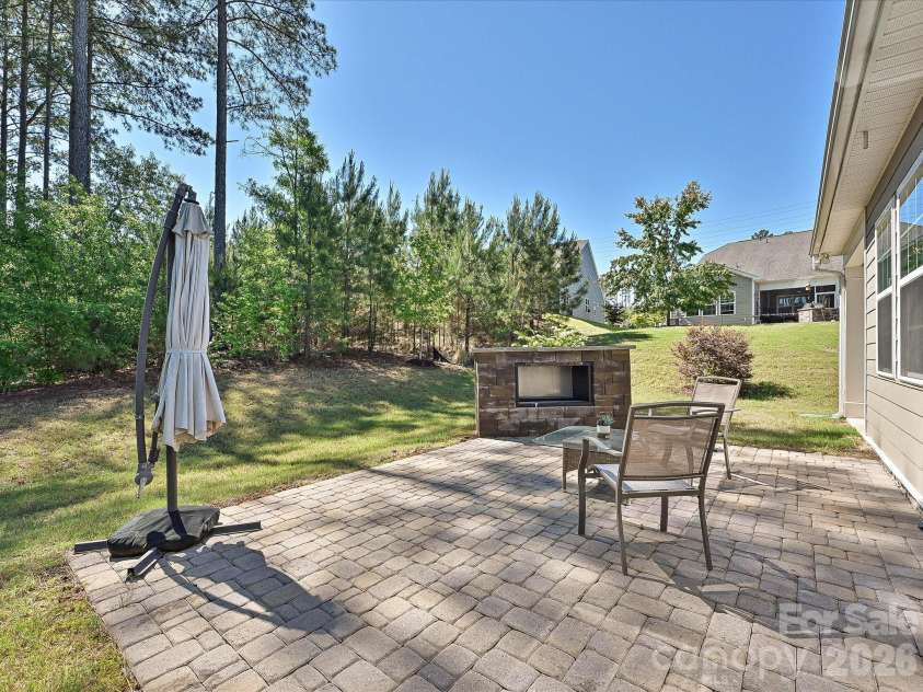 304 Picasso Trail, Mount Holly, NC 28120.  MLS# CAR4374273, YatesRealty ID 19998. Backyard area designed and utilized specifically for outdoor entertaining