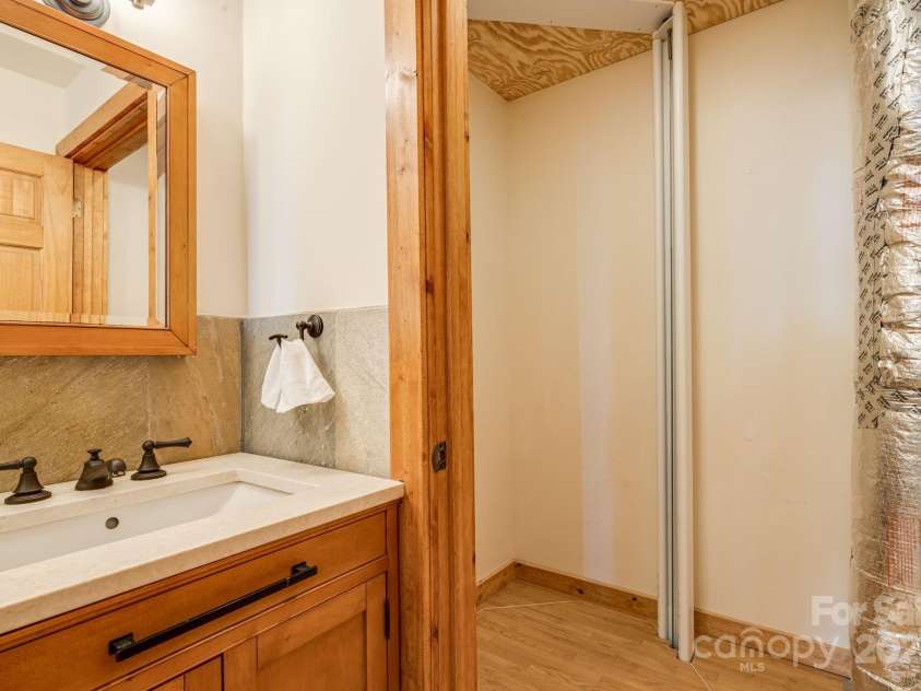 765/764 Osborne Knob Road, Little Switzerland, NC 28752.  MLS# CAR4303194, YatesRealty ID 200. Elevator entrance to primary bedroom