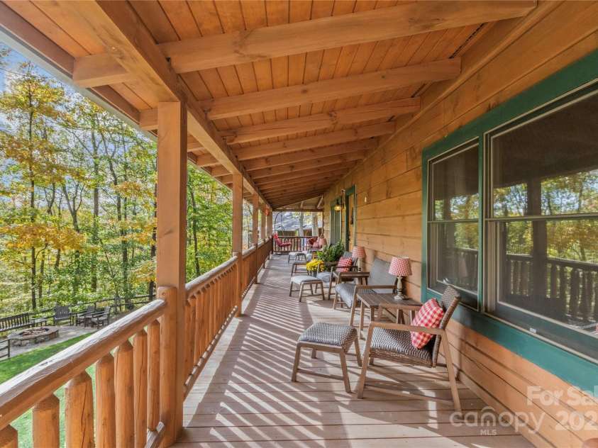 351 Buck Springs Run, Mars Hill, NC 28754.  MLS# CAR4320450, YatesRealty ID 2000. Wrapping the front porch to the side and back for entertaining sets an inviting experience which connects to the Pool House and more 