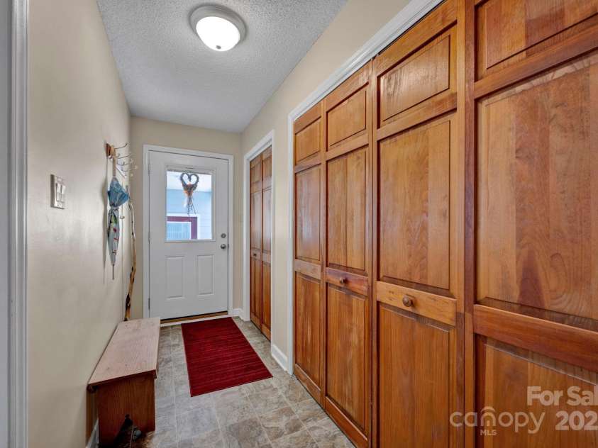 161 Picwyck Drive, Mooresville, NC 28115.  MLS# CAR4211316, YatesRealty ID 20000. Mudroom with Laundry Closet on Main leads to Breezway to Garage
