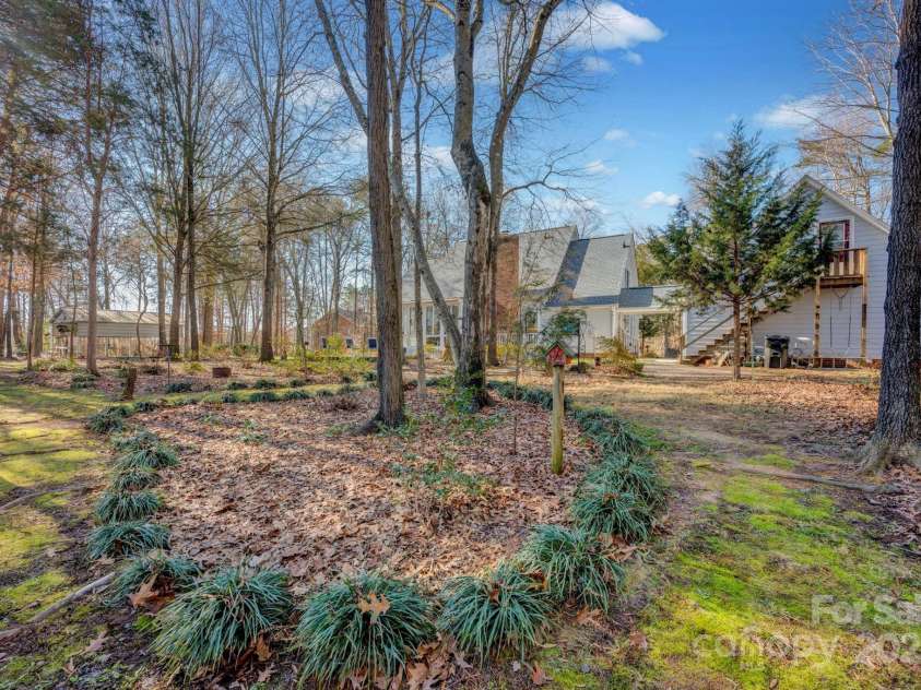 161 Picwyck Drive, Mooresville, NC 28115.  MLS# CAR4211316, YatesRealty ID 20000. Steps at Back of Garage Lead to Extra Heated/Cooled Bonus Room above Garage
