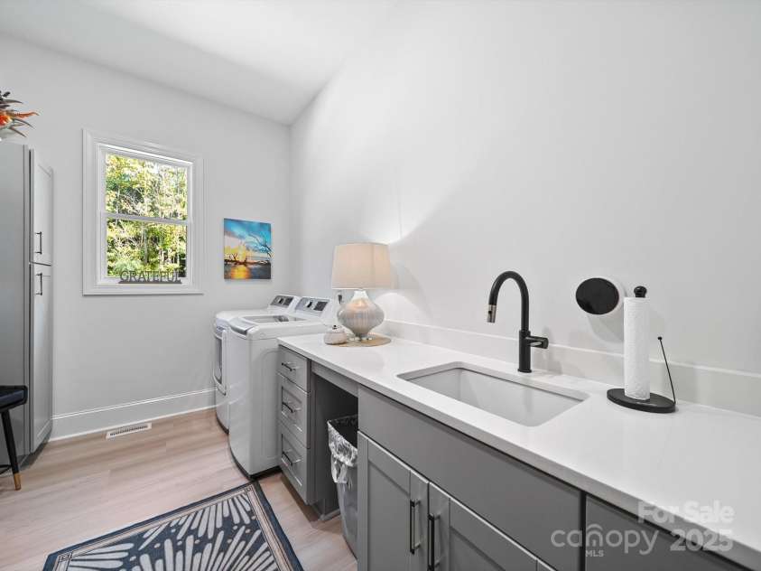 1045 Churchfield Lane, Rockwell, NC 28138.  MLS# CAR4310058, YatesRealty ID 2001. Laundry room with built ins