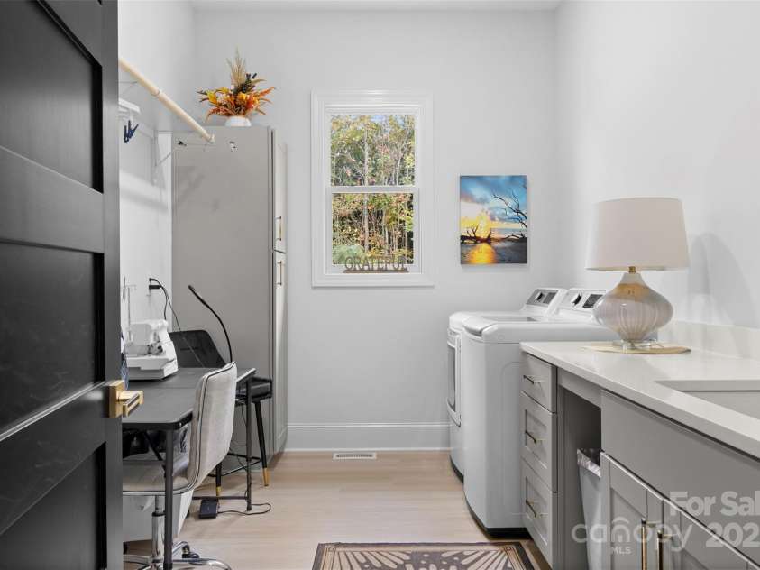 1045 Churchfield Lane, Rockwell, NC 28138.  MLS# CAR4310058, YatesRealty ID 2001. Laundry room with built ins and room for art and craft projects. 