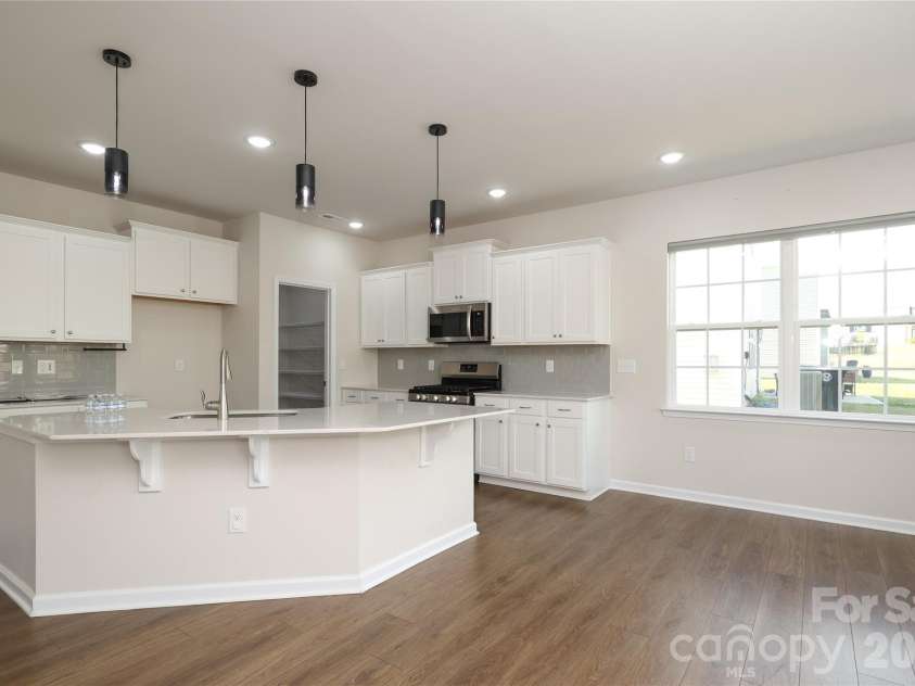 339 Kennerly Center Drive, Mooresville, NC 28115.  MLS# CAR4329457, YatesRealty ID 20011. Open kitchen with dining
