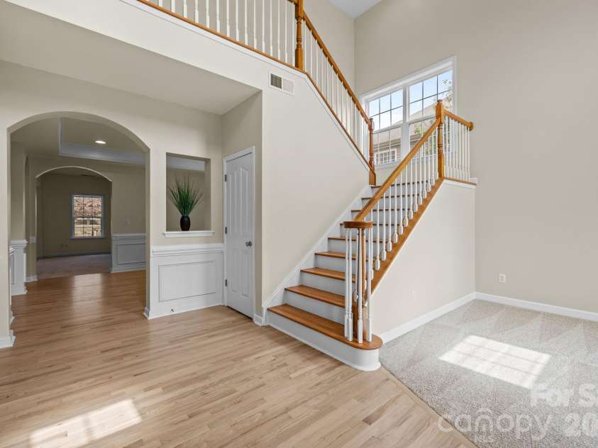 8108 Acacia Court, Waxhaw, NC 28173.  MLS# CAR4341327, YatesRealty ID 20018. Foyer - extra storage in the closet under the stairs8108 Acacia CourtWaxhaw, NC 28173Providence Grove
