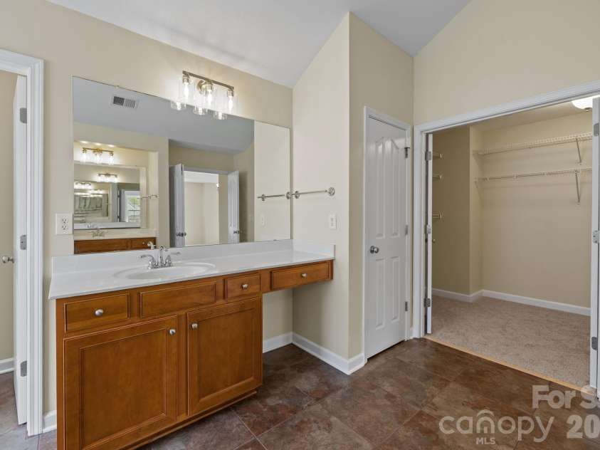8108 Acacia Court, Waxhaw, NC 28173.  MLS# CAR4341327, YatesRealty ID 20018. Vanity with room for chair8108 Acacia CourtWaxhaw, NC 28173Providence Grove