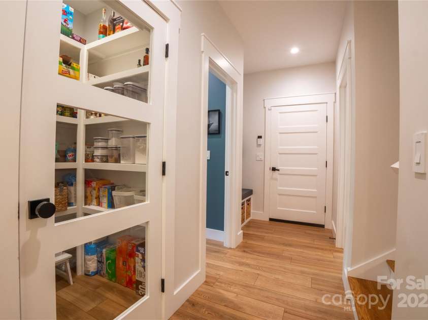 13 Cambridge Drive, Candler, NC 28715.  MLS# CAR4249606, YatesRealty ID 20021. Large pantry at kitchen