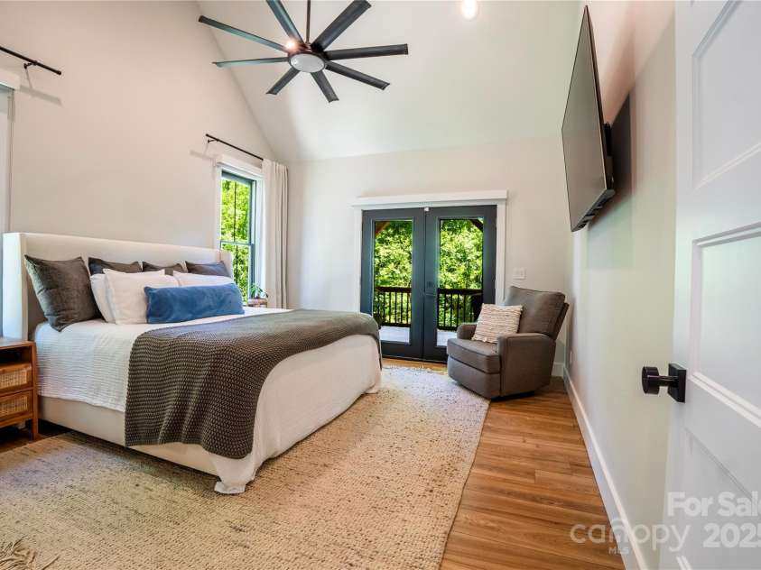 13 Cambridge Drive, Candler, NC 28715.  MLS# CAR4249606, YatesRealty ID 20021. Main-Level primary suite with private access to covered deck