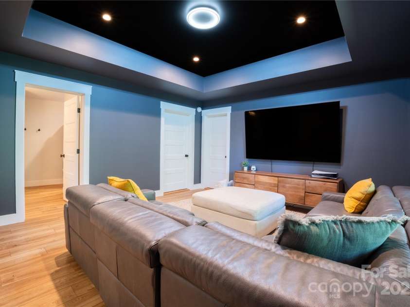 13 Cambridge Drive, Candler, NC 28715.  MLS# CAR4249606, YatesRealty ID 20021. Media room flex space in walk out basement