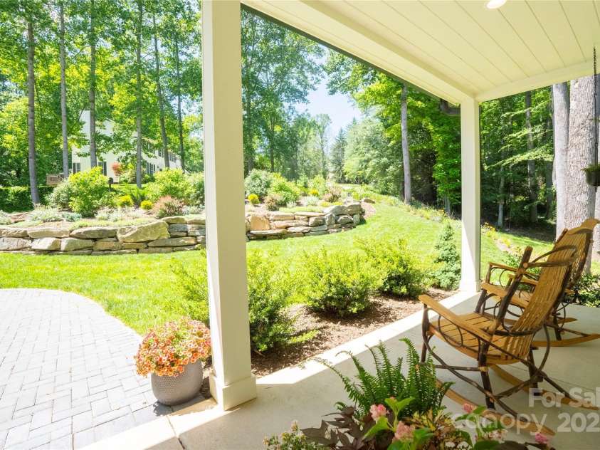 13 Cambridge Drive, Candler, NC 28715.  MLS# CAR4249606, YatesRealty ID 20021. Multiple covered outdoor living areas, including a gracious front porch