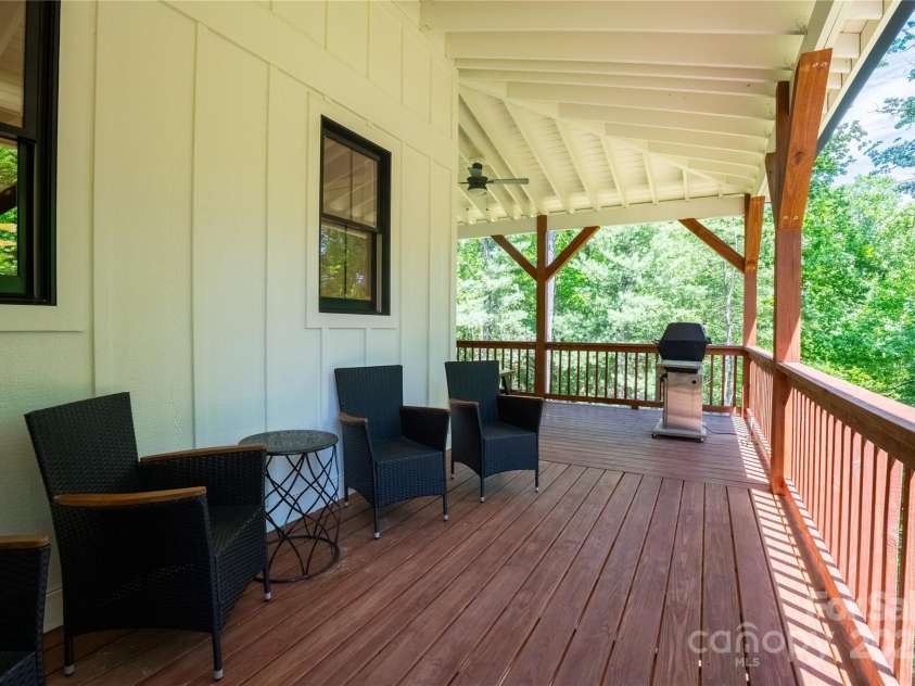13 Cambridge Drive, Candler, NC 28715.  MLS# CAR4249606, YatesRealty ID 20021. Room to gather and entertain on covered and protected porches
