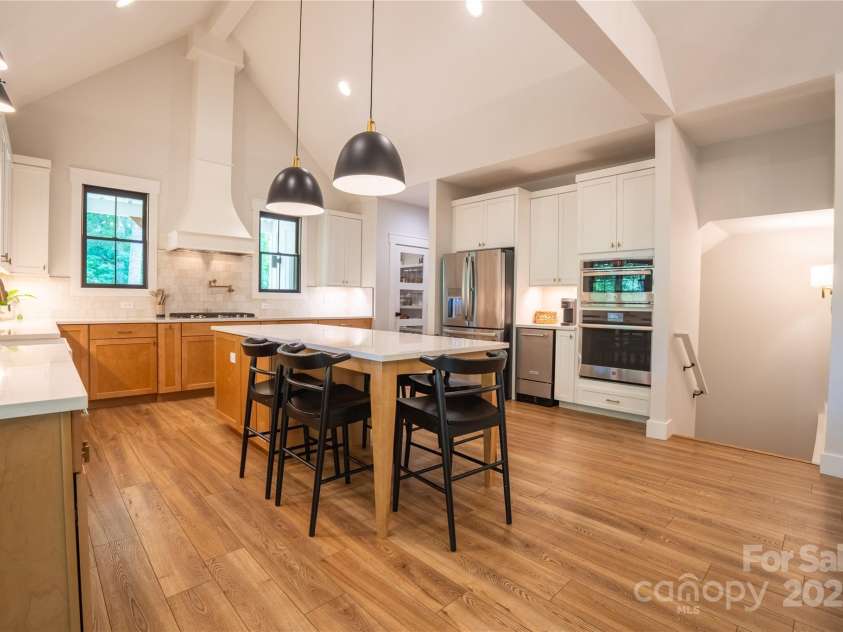 13 Cambridge Drive, Candler, NC 28715.  MLS# CAR4249606, YatesRealty ID 20021. Soaring vaulted ceilings, exposed wood beams