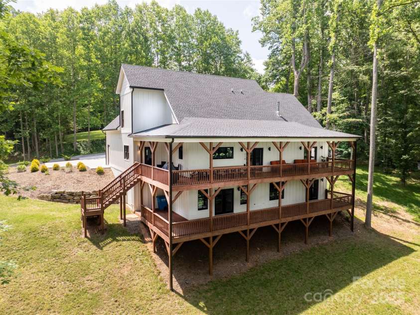 13 Cambridge Drive, Candler, NC 28715.  MLS# CAR4249606, YatesRealty ID 20021. Two levels of luxury decking for seamless indoor/outdoor living