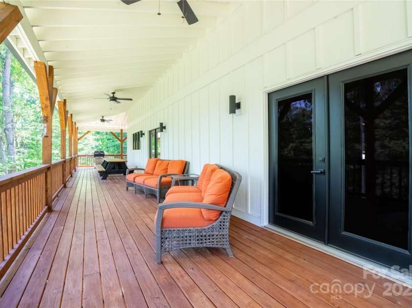 13 Cambridge Drive, Candler, NC 28715.  MLS# CAR4249606, YatesRealty ID 20021. Two levels ofexpansive covered back decks, invite you to enjoy North Carolina’s four seasons