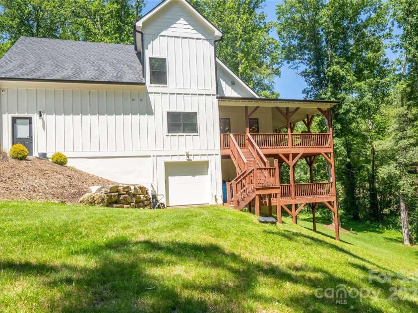13 Cambridge Drive, Candler, NC 28715.  MLS# CAR4249606, YatesRealty ID 20021. Two levels ofexpansive covered back decks, invite you to enjoy North Carolina’s four seasons