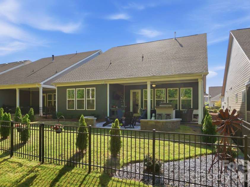 2002 Belle Mont Farm Avenue, Monroe, NC 28110.  MLS# CAR4366428, YatesRealty ID 20023. Backyard with fence