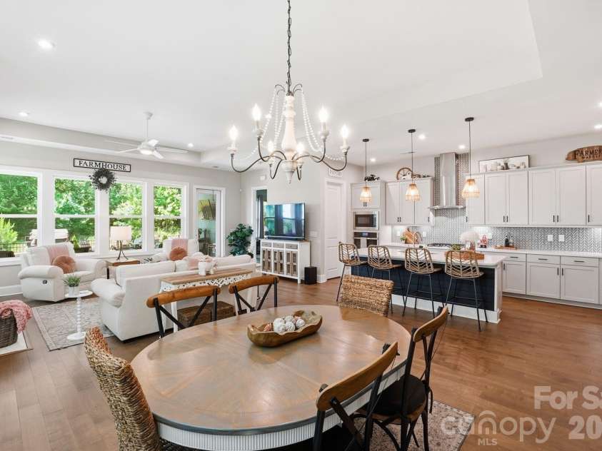 2002 Belle Mont Farm Avenue, Monroe, NC 28110.  MLS# CAR4366428, YatesRealty ID 20023. Dining, kitchen and great room