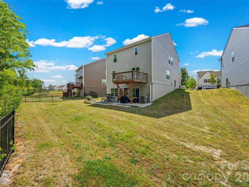 2742 Oldfield Drive, Monroe, NC 28110.  MLS# CAR4365069, YatesRealty ID 20025. Level, cleared yard backing to mature trees