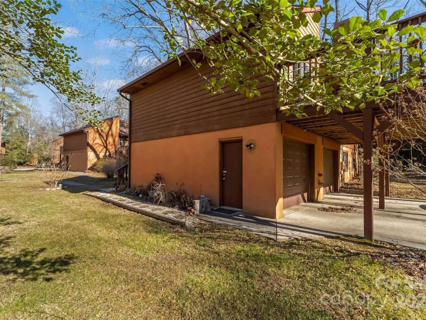 39 Oak Court, Fletcher, NC 28732.  MLS# CAR4330927, YatesRealty ID 20027. Attached double garage with side entry