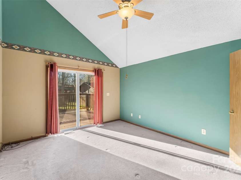 39 Oak Court, Fletcher, NC 28732.  MLS# CAR4330927, YatesRealty ID 20027. Primary suite with private access to deck. 