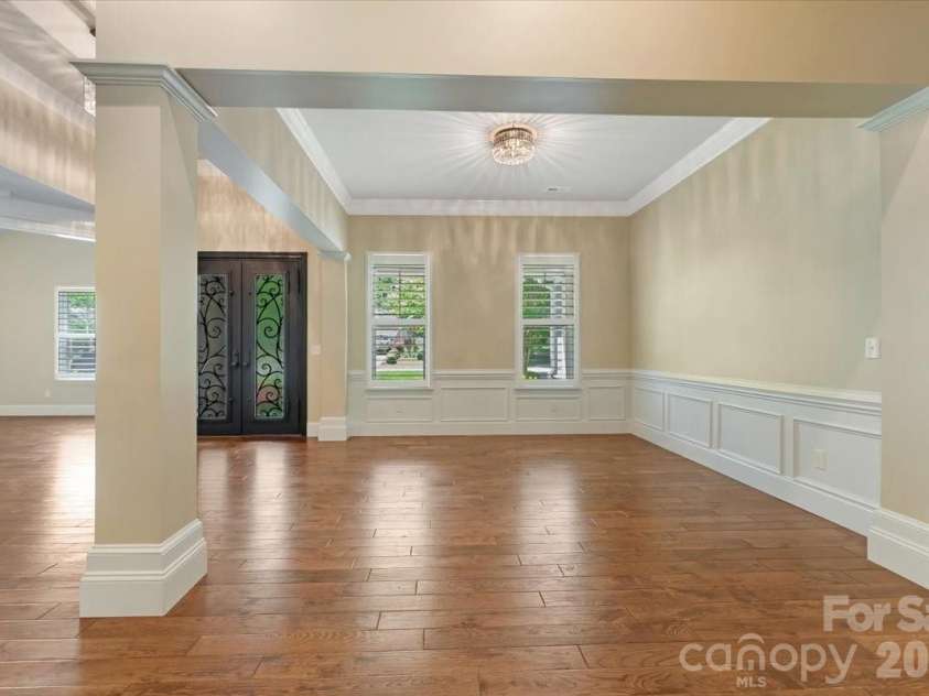 7304 Sedgebrook Drive, Stanley, NC 28164.  MLS# CAR4372754, YatesRealty ID 20028. Custom metal double doors set the tone from the moment you arrive — bold, intentional, and unmistakably this home.