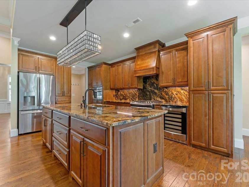 7304 Sedgebrook Drive, Stanley, NC 28164.  MLS# CAR4372754, YatesRealty ID 20028. Every drawer. Every cabinet. Soft-close, custom built, and thoughtfully designed so there is a place for everything and everything has its place.
