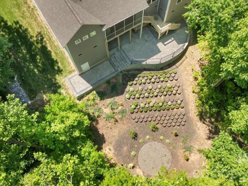 7304 Sedgebrook Drive, Stanley, NC 28164.  MLS# CAR4372754, YatesRealty ID 20028. From above the picture becomes clear — a backyard this private, this spacious, and this beautifully situated was made for fall evenings around a firepit with the people who matter most.