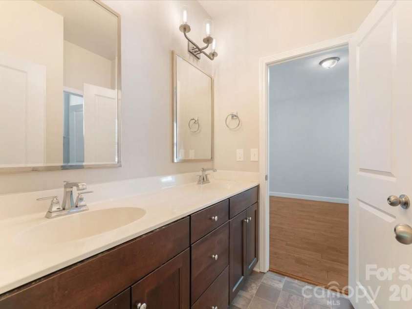 7304 Sedgebrook Drive, Stanley, NC 28164.  MLS# CAR4372754, YatesRealty ID 20028. The Jack and Jill bath delivers where it counts — dual sinks, a luxury height vanity, and a design that makes sharing a bathroom feel like anything but a compromise.