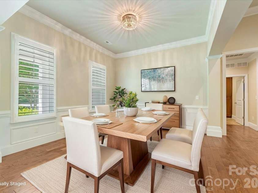 7304 Sedgebrook Drive, Stanley, NC 28164.  MLS# CAR4372754, YatesRealty ID 20028. The staging sets the table — the natural light, hardwoods, and statement fixture make sure every gathering feels effortless and elevated.