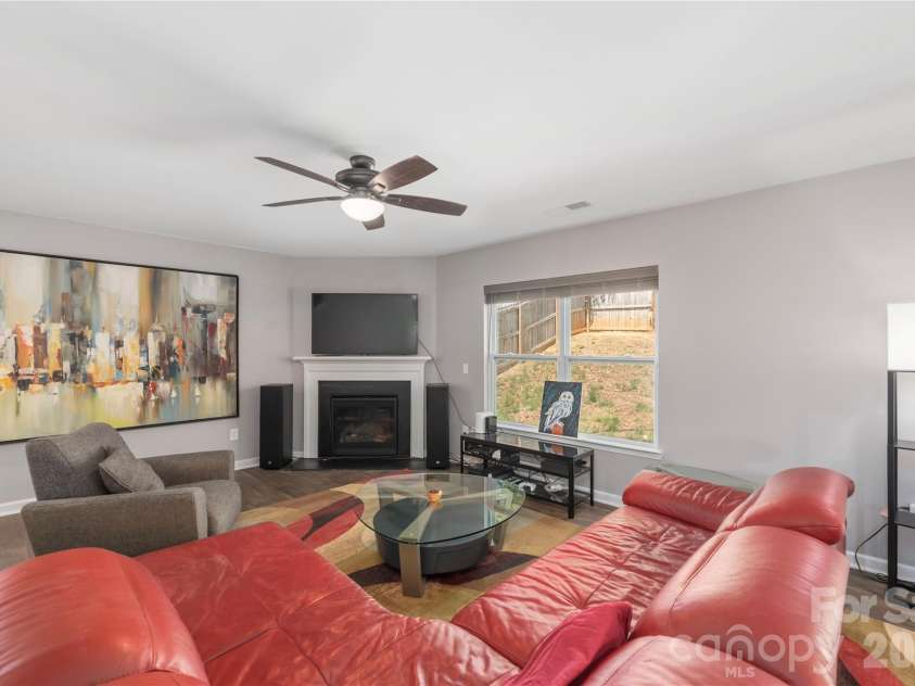 220 Roper Street, Candler, NC 28715.  MLS# CAR4372935, YatesRealty ID 20031. Cozy den with gas logs