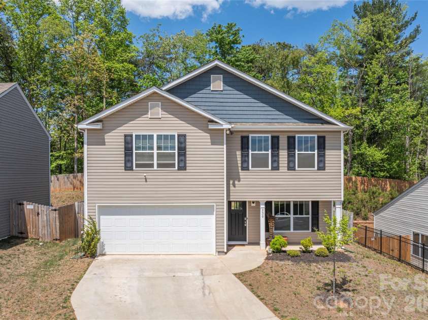 220 Roper Street, Candler, NC 28715.  MLS# CAR4372935, YatesRealty ID 20031. Quality concrete driveway