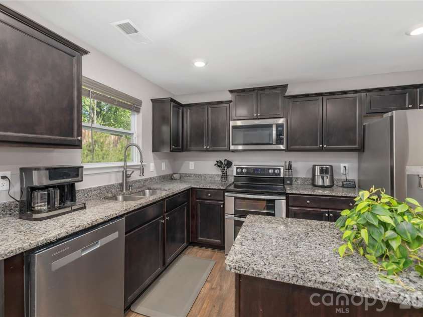 220 Roper Street, Candler, NC 28715.  MLS# CAR4372935, YatesRealty ID 20031. Upgraded stainless steel appliances and faucet