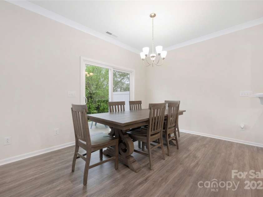 23112 Clarabelle Drive, Charlotte, NC 28273.  MLS# CAR4244219, YatesRealty ID 20035. Dining Room with door to patio