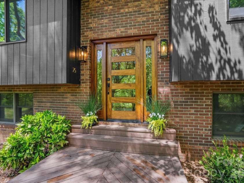 75 High Valley Estates Drive, Alexander, NC 28701.  MLS# CAR4372479, YatesRealty ID 20036. Stunning new mahogany front door entry and front deck.