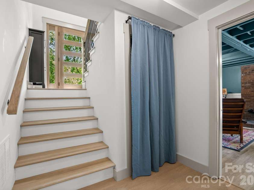 75 High Valley Estates Drive, Alexander, NC 28701.  MLS# CAR4372479, YatesRealty ID 20036. Under stairwell storage