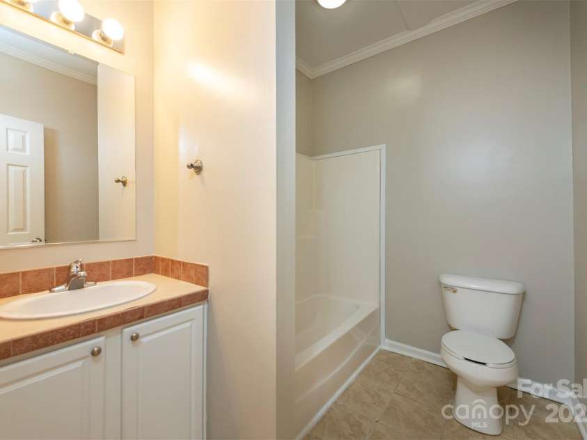 9 Everwood Drive, Candler, NC 28715.  MLS# CAR4269275, YatesRealty ID 20048. Downstairs bathroom