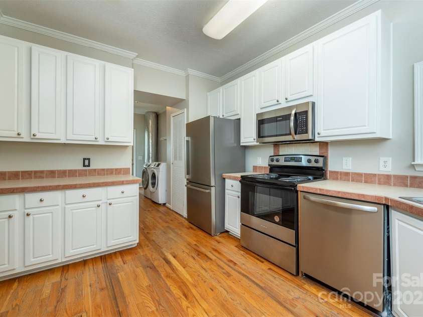 9 Everwood Drive, Candler, NC 28715.  MLS# CAR4269275, YatesRealty ID 20048. Freshly painted cabinets