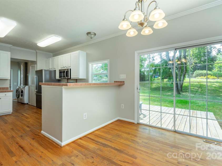 9 Everwood Drive, Candler, NC 28715.  MLS# CAR4269275, YatesRealty ID 20048. Kitchen and dining area