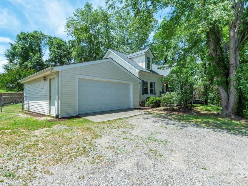 9 Everwood Drive, Candler, NC 28715.  MLS# CAR4269275, YatesRealty ID 20048. Two car garage and parking for multiple cars of rv/boat