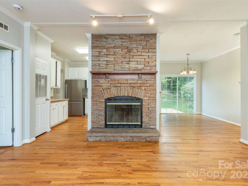 9 Everwood Drive, Candler, NC 28715.  MLS# CAR4269275, YatesRealty ID 20048. Wood burning fireplace in living room