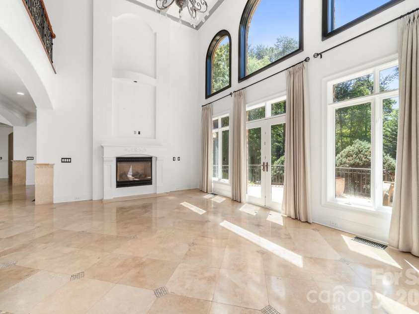 18805 Windy Point Drive, Cornelius, NC 28031.  MLS# CAR4373578, YatesRealty ID 20049. 20 foot high ceilings and floor to ceiling windows