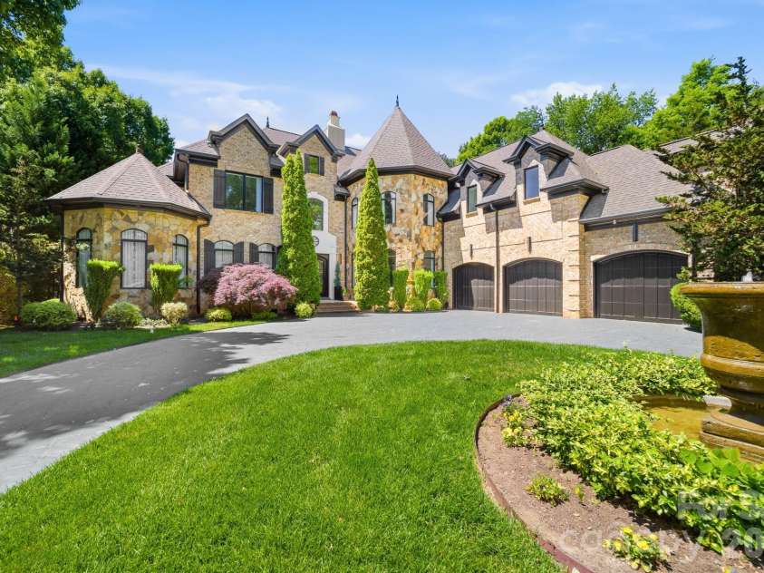 18805 Windy Point Drive, Cornelius, NC 28031.  MLS# CAR4373578, YatesRealty ID 20049. Three car garage & circular drive