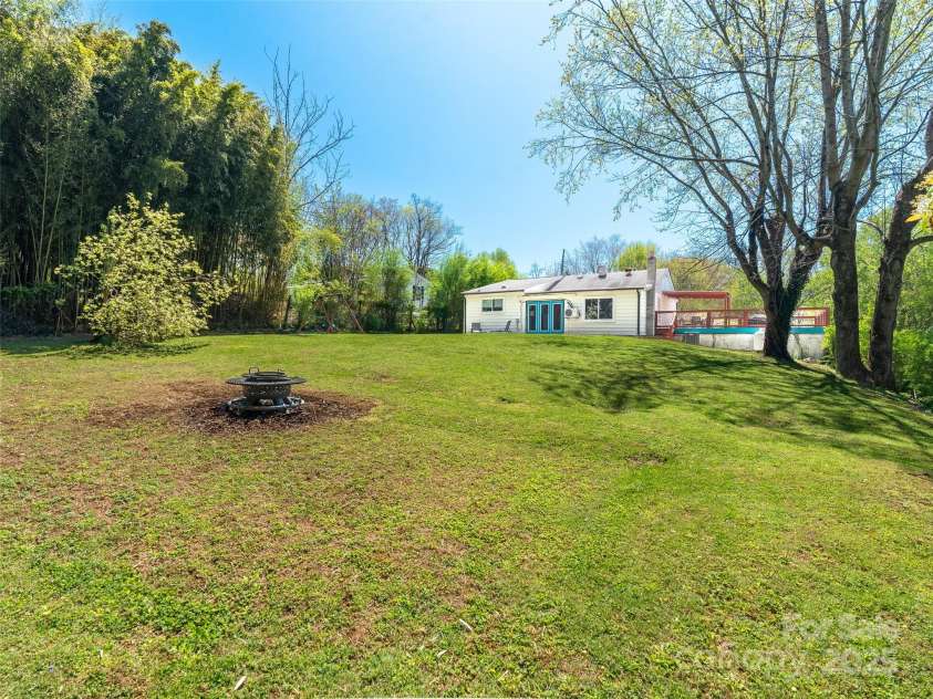 234 Monte Vista Road, Candler, NC 28715.  MLS# CAR4228633, YatesRealty ID 20050. Backyard is flat and usable!
