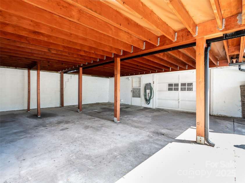 234 Monte Vista Road, Candler, NC 28715.  MLS# CAR4228633, YatesRealty ID 20050. Carport parking for 2 cars. Entry to basement.