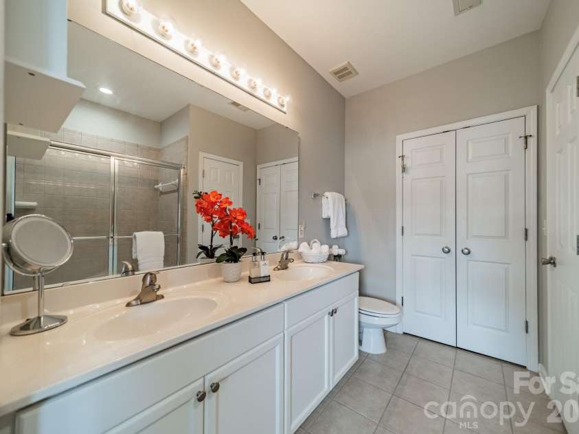 18736 Nautical Drive, Cornelius, NC 28031.  MLS# CAR4371248, YatesRealty ID 20051. Primary bath has a long, double vanity to keep you organized and comfortable.  NOTE - there are two closets.