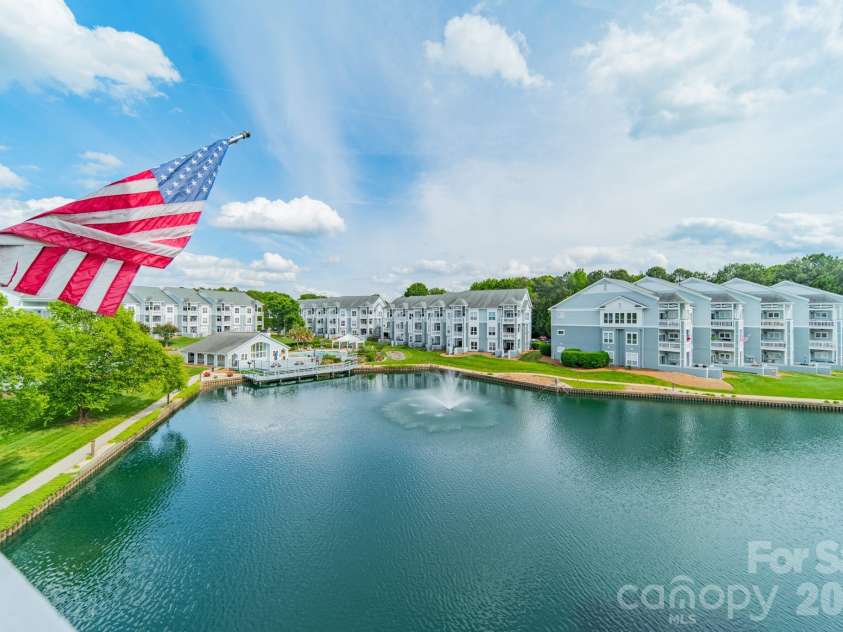 18736 Nautical Drive, Cornelius, NC 28031.  MLS# CAR4371248, YatesRealty ID 20051. Serene and lovely setting behind the condo! Nice views from other angles, too.