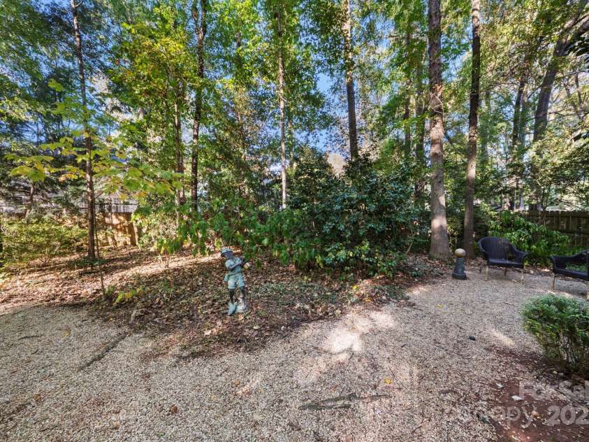 5550 Monticello Drive, Concord, NC 28027.  MLS# CAR4314212, YatesRealty ID 20051. Decorative pea gravel on paths